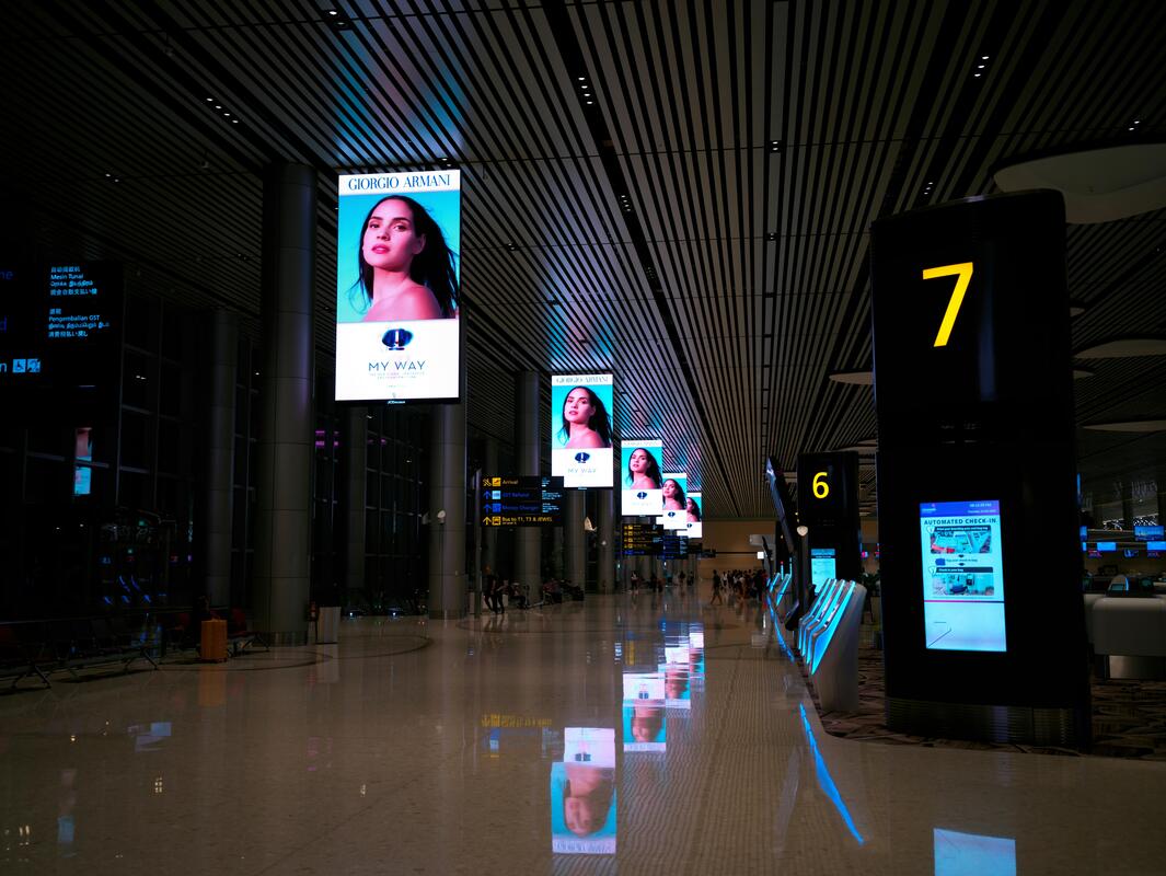 Enterprise digital signage platform showing synchronised airport flight information displays